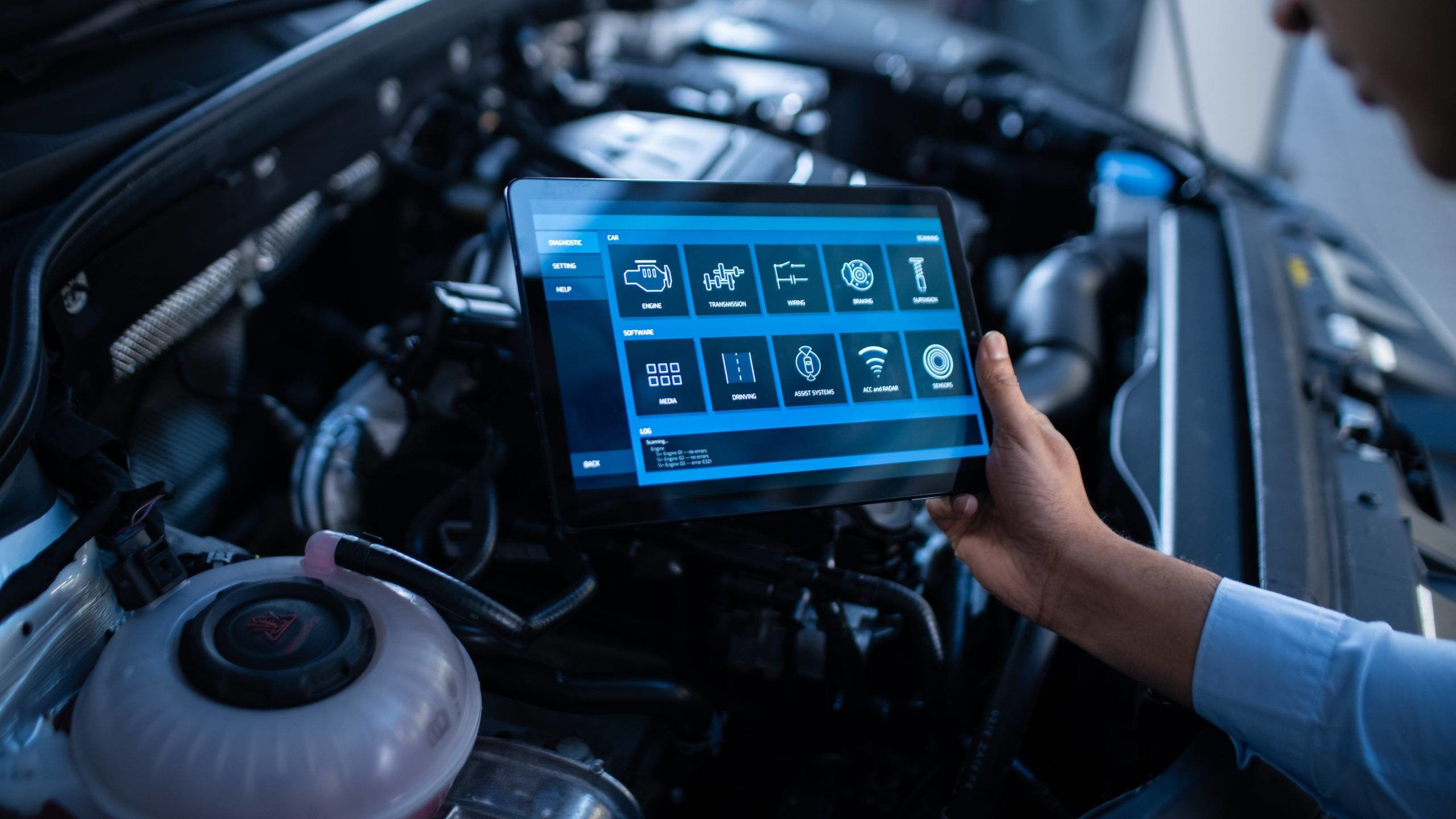 Car Service Manager or Mechanic Uses a Tablet Computer with a Fu